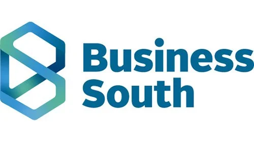 Business South logo with a stylized hexagon icon and the words 'Business South' in blue text.
