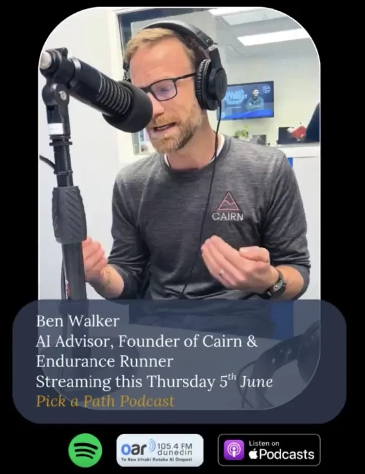 Ben Walker, an AI advisor and founder of Cairn & Endurance Runner, speaking into a microphone with headphones on during a podcast recording.